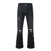 Todroki Night Weave black flare denim with plaid-backed rips – front